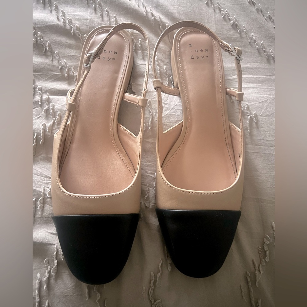 Beige and black flats